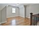 Bright upstairs bedroom with hardwood floors and a window for plenty of natural light at 210 Short Rd, Sharpsburg, GA 30277