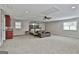 Spacious bedroom featuring a seating area, four poster bed, and a convenient wet bar at 210 Short Rd, Sharpsburg, GA 30277