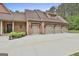 Attached four car garage offering ample parking and storage, set on a concrete driveway at 210 Short Rd, Sharpsburg, GA 30277