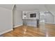 Upstairs hallway area with hardwood flooring, natural lighting, and overhead chandelier at 210 Short Rd, Sharpsburg, GA 30277