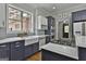 Stylish kitchen featuring a gas cooktop on the island, stainless steel appliances, and ample counter space at 210 Short Rd, Sharpsburg, GA 30277