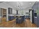 Kitchen featuring dark wood cabinets, a kitchen island, and seating for two at 210 Short Rd, Sharpsburg, GA 30277