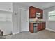 View of the kitchen area showing modern cabinets, stainless appliances, and granite countertops at 210 Short Rd, Sharpsburg, GA 30277