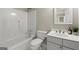 Clean bathroom with white fixtures, vanity and shower-tub combo at 3600 Goldenrod Dr, Alpharetta, GA 30005