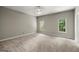 Spacious bedroom with plush carpet, and multiple windows providing ample natural light at 3600 Goldenrod Dr, Alpharetta, GA 30005