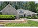 Charming home featuring well-manicured landscaping and a stone walkway at 3600 Goldenrod Dr, Alpharetta, GA 30005