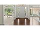 Grand foyer with large windows, natural light, gleaming hardwood floors, and an open floor plan at 3600 Goldenrod Dr, Alpharetta, GA 30005
