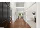Inviting foyer with gleaming hardwood floors, soaring ceilings, and a view to the light-filled living spaces at 3600 Goldenrod Dr, Alpharetta, GA 30005
