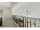Upper hallway overlooking living room, featuring white railings and black spindles at 3600 Goldenrod Dr, Alpharetta, GA 30005