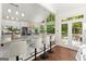 Kitchen island with barstools and stainless steel appliances at 3600 Goldenrod Dr, Alpharetta, GA 30005