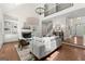 Open living room with high ceilings, fireplace, and wood floors at 3600 Goldenrod Dr, Alpharetta, GA 30005