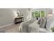 Serene bedroom featuring a large bed, soft lighting, and views of a verdant landscape at 3600 Goldenrod Dr, Alpharetta, GA 30005