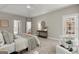 Spacious main bedroom suite with tray ceiling, ensuite, and sitting area with outdoor access at 3600 Goldenrod Dr, Alpharetta, GA 30005