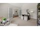 Stylish office space with French doors, neutral carpet, and a decorative mirror at 3600 Goldenrod Dr, Alpharetta, GA 30005