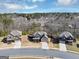 Aerial view of suburban homes with well-maintained lawns in a picturesque neighborhood at 10736 Southwood Dr, Hampton, GA 30228