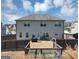 View of the backyard with a gray house and a new wooden fence around the parameter at 10736 Southwood Dr, Hampton, GA 30228