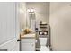 Half bathroom with nice decorations and granite countertop at 10736 Southwood Dr, Hampton, GA 30228