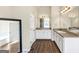 Spacious bathroom with double sink vanity, decorative floors and granite countertops at 10736 Southwood Dr, Hampton, GA 30228