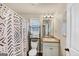 Full bathroom with shower and tub, and a white patterned shower curtain at 10736 Southwood Dr, Hampton, GA 30228