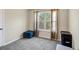 Carpeted bedroom with large window allowing natural light at 10736 Southwood Dr, Hampton, GA 30228
