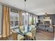 Bright dining area with a glass table, chairs, and sliding glass doors at 10736 Southwood Dr, Hampton, GA 30228