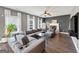 Inviting living room with a fireplace, TV, and a comfortable sectional sofa at 10736 Southwood Dr, Hampton, GA 30228