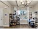 Bright living room with large windows, shelving units, and stylish decor creates a cozy atmosphere at 10736 Southwood Dr, Hampton, GA 30228