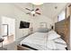 Main bedroom with a ceiling fan and en-suite bathroom at 10736 Southwood Dr, Hampton, GA 30228