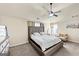 Main bedroom features a ceiling fan, en-suite bathroom, and sitting area at 10736 Southwood Dr, Hampton, GA 30228