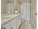Bathroom features a granite countertop, tile floors, and shower at 500 Merrill Ln, Peachtree City, GA 30269