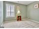 Neutral bedroom with large windows features neutral carpet and paint at 500 Merrill Ln, Peachtree City, GA 30269