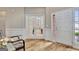 Bright foyer with hardwood floors and an office in the background at 500 Merrill Ln, Peachtree City, GA 30269