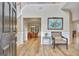 Bright foyer with hardwood floors and open view to dining area at 500 Merrill Ln, Peachtree City, GA 30269