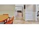 Hallway leading to living space with wood-look flooring and white wainscoting at 500 Merrill Ln, Peachtree City, GA 30269