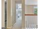 Upstairs hallway leads to carpeted bedroom at 500 Merrill Ln, Peachtree City, GA 30269