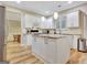 Well-lit kitchen featuring white cabinetry, stainless steel appliances, and granite countertops at 500 Merrill Ln, Peachtree City, GA 30269