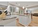 Open kitchen layout featuring granite countertops, white cabinets, and stainless appliances at 500 Merrill Ln, Peachtree City, GA 30269