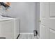 Clean laundry room features tile floor and modern appliances at 500 Merrill Ln, Peachtree City, GA 30269