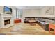 Spacious living room with a cozy fireplace and a comfortable leather sectional sofa at 500 Merrill Ln, Peachtree City, GA 30269