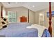 Comfortable main bedroom featuring a four-poster bed with plush bedding and a window view at 500 Merrill Ln, Peachtree City, GA 30269
