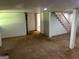 Finished basement area with plush carpeting, access to stairs, and ample storage space at 3551 Skyline Sw Ter, Marietta, GA 30008