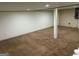 Spacious basement with new carpet flooring and neutral paint, offering a blank canvas at 3551 Skyline Sw Ter, Marietta, GA 30008