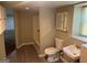 Bathroom with new flooring, a tub, and a window, offering a relaxing space at 3551 Skyline Sw Ter, Marietta, GA 30008