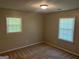 Carpeted bedroom offering great natural light from two windows at 3551 Skyline Sw Ter, Marietta, GA 30008