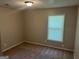 Bedroom with carpet, neutral walls, and a window, offering a cozy and inviting space at 3551 Skyline Sw Ter, Marietta, GA 30008