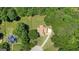 Aerial view of the home nestled among lush trees, showcasing the expansive property at 940 Planters Pl, Loganville, GA 30052