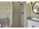 Modern bathroom with a stylish glass-enclosed shower and updated fixtures at 940 Planters Pl, Loganville, GA 30052