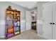 Neutral bedroom features carpet, white walls, and view to the hallway at 940 Planters Pl, Loganville, GA 30052