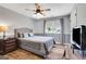 Calming bedroom features grey walls, wood-look floors, and natural light from a window at 940 Planters Pl, Loganville, GA 30052
