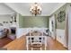 Cozy dining room with a decorative chandelier and a view of the living area at 940 Planters Pl, Loganville, GA 30052